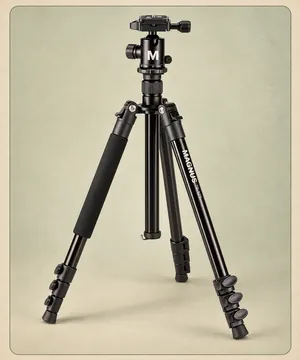 The tall tripod, legs extended, with its ball head.