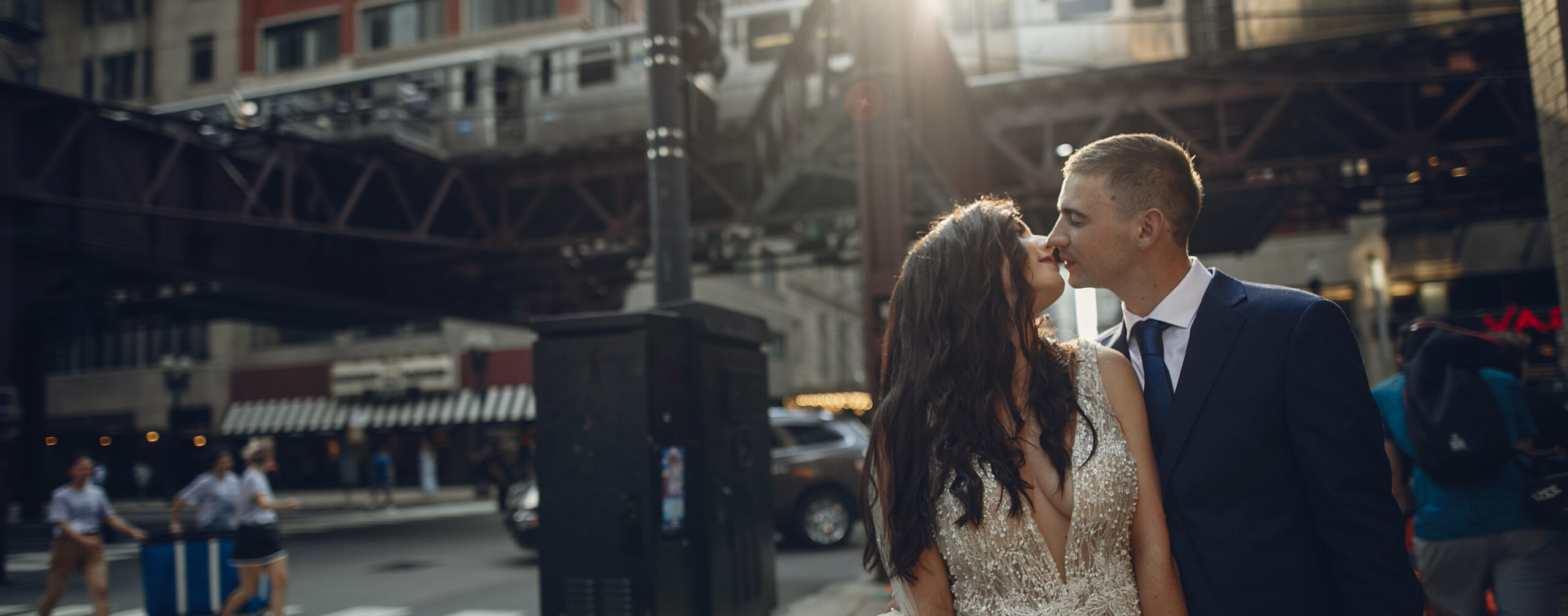 bride-and-groom-kissing-under-a-bridge-in-the-city