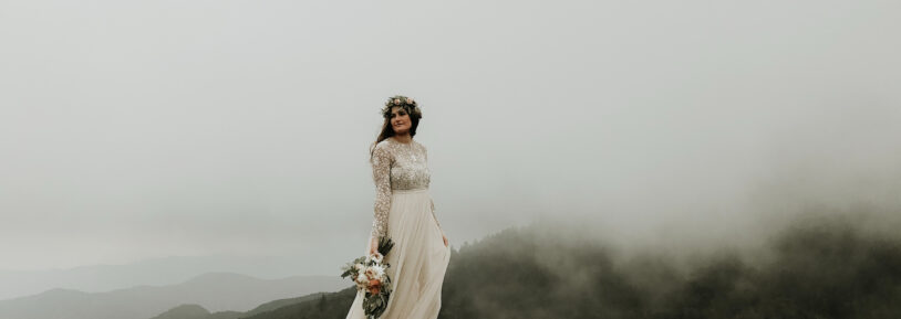 bride-posing-on-a-foggy-mountain