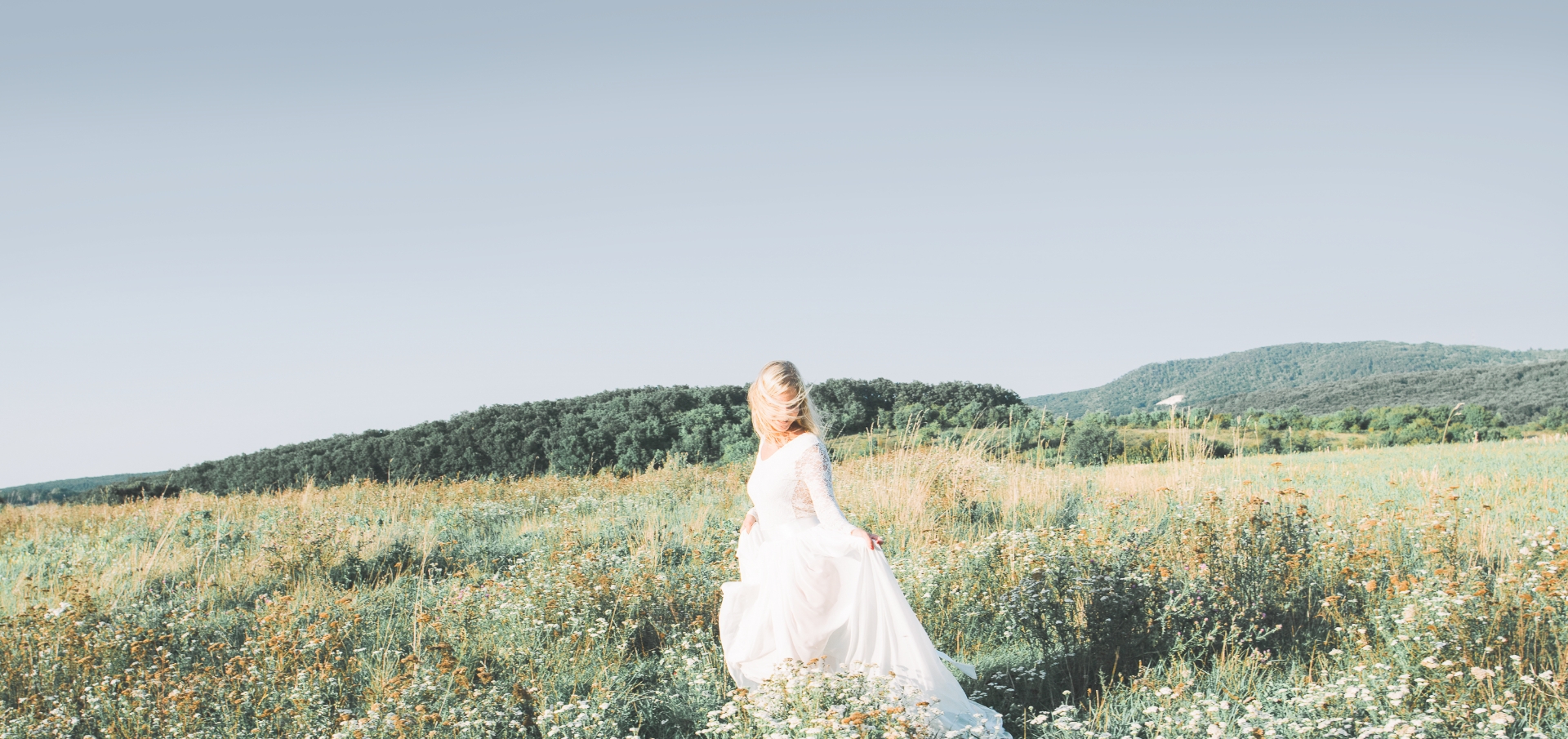bride in a field of flowers